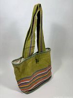 Full view of woven olive green cotton shoulder bag showing stripes and dual straps