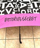 Close-up of pink trim with Victoria’s Secret logo and letter graphic canopy
