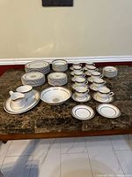 Entire Aynsley china service set displayed on table