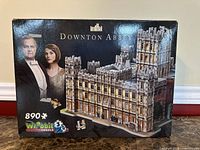 Front of sealed Wrebbit Downton Abbey 3D puzzle box showing artwork, piece count and branding
