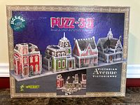Front of box showing Victorian Avenue completed model, branding and piece count.