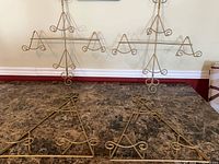 All four gold-tone metal plate holders on countertop