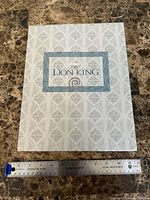 Patterned presentation folder closed with ruler for scale