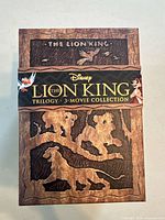 Wood-carved look slipcase Lion King Trilogy collection