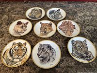 All eight Lenox plates arranged face up