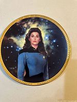 Front of plate showing Deanna Troi artwork and gold rim