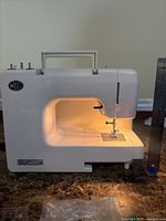 Front view of Kenmore sewing machine showing illuminated workspace