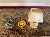 Three candle holders on table