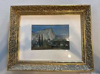 Full view of framed painting with mat