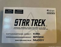 Outer white box front showing STAR TREK branding and character names