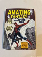Front view showing Amazing Fantasy Spider-Man comic cover artwork