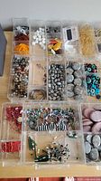 Organizer compartments showing various beads and findings