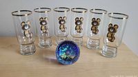Full lot: six Misha Bear glasses and Caithness paperweight