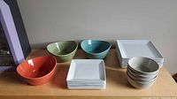 Entire lot on tabletop showing bowls and plates