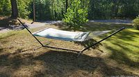 Full view of hammock assembled on steel stand outdoors