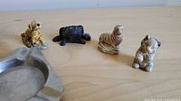 Group of Wade porcelain figurines, black frog and ashtray