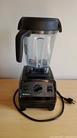 Full view of Vitamix Explorian E320 blender with jar and lid