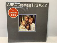 Front cover of sealed ABBA Greatest Hits Vol.2 LP showing shrinkwrap and price sticker