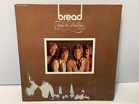 Front sleeve of Bread Baby I'm-A Want You LP showing artwork and tearing