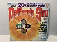 Front cover of K-tel California Sun LP showing title, label logo and artist montage