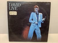 Front cover of David Live double LP shows album art and wear