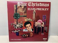 Front cover showing title, artist name, gift imagery, Elvis photo, RCA logo