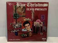 Front cover sealed in shrink wrap with price sticker