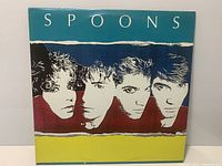 Front cover of Spoons Arias & Symphonies LP showing artwork and title