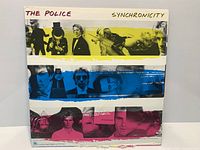Front cover of The Police Synchronicity LP showing artwork and condition
