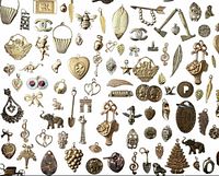 Full layout of assorted gold-tone charms on white background