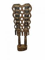 Front view Yoruba wooden statue showing carved motifs and openwork