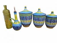 Full set showing three ceramic canisters with lids, ceramic oil cruet, green glass bottle