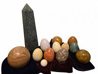 Full group: obelisk, eggs and velvet cushions