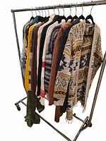 Full rack showing quantity and variety of sweaters