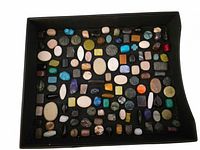 Tray of assorted beads showing variety