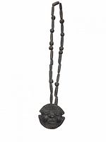 Full view of necklace showing bead pattern and pendant