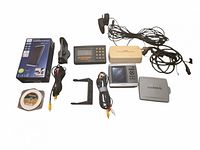 Full lot laid out showing all devices, cables, antenna, spool and accessories