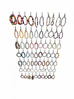 Full view of approx. 55 assorted handmade beaded bracelets hung in rows