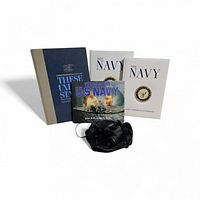 Front view of all books and binoculars with case