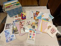 Top view of greeting cards spread out with storage box visible