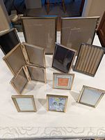Front view showing entire assortment of photo frames of various sizes and finishes