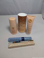 Group shot of all six Avon items standing on surface
