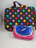 Exterior view of toiletry bag with multicolor polka dots and sealed makeup pouch