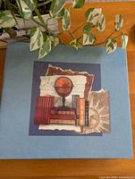 Front cover of blue scrapbook album with printed design