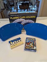 Two blue plastic card holders, two sealed decks, Jobar box