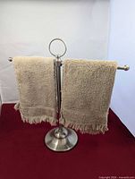 Towel rack front view with two towels draped