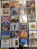 Grid view of all 24 CDs showing artists and titles