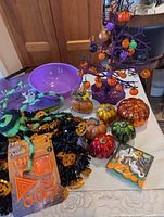 Overview of lot showing bowls, tree, pumpkins, carving kit, garland, spider, tote and napkins