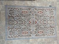 Full view of the rectangular patterned rug showing overall design and colors