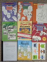 All nine items laid out, showing covers and binder